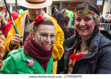 COLOGNE, GERMANY - MARCH 03: unidentified and costumed women at the Rose Monday parade on March 03, 2014 in Cologne. The parade in Cologne is the largest in the same line in Germany.