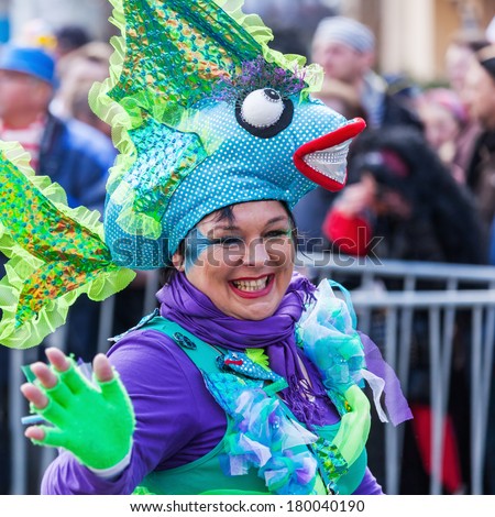 COLOGNE, GERMANY - MARCH 03: unidentified and costumed woman at the Rose Monday parade on March 03, 2014 in Cologne. The parade is the largest one in Germany.