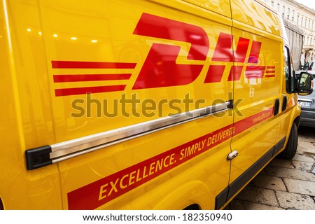 MILAN, ITALY - FEBRUARY 20: DHL transporter on a street on February 20, 2014 in Milan. DHL is the world\'s top-selling logistics company.