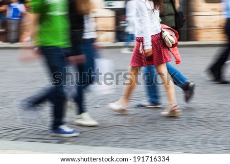 busy people walking on the road in motion blur