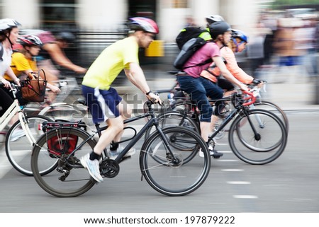 bicycle rider on a city street in motion blur