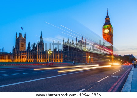 Westminster Palace and Big Ben with blue night sky and light trails of the traffic Westminster Palace and Big Ben with blue night sky and light trails of the traffic
