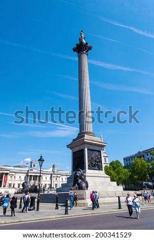 LONDON - MAY 19: Nelsons Column with unidentified people on May 19, 2014 in London. Nelsons Column at Trafalgar Square was built to commemorate Admiral Horatio Nelson, died at the Battle of Trafalgar