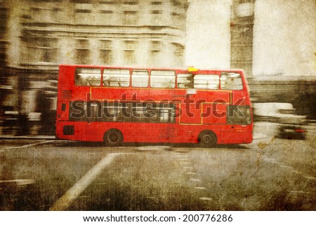 vintage style picture of a red London Bus in motion blur in the city of London