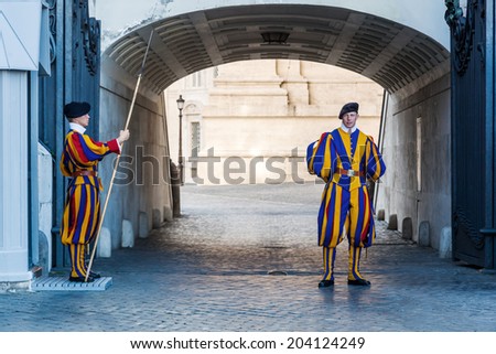 ROME - JULY 01: unidentified members of the Pontifical Swiss Guard on July 01, 2014 in Rome. It is a force responsible for the safety of the Pope the Apostolic Palace and it is the military of Vatican