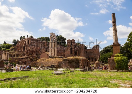 ROME - JUNE 30: Roman Forum with unidentified people on June 30, 2014 in Rome. The anicent forum is today a sprawling ruin of fragments and archaeological excavations for 4.5 million sightseers yearly