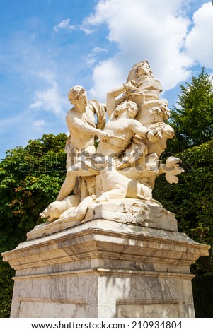 VERSAILLES, FRANCE - AUGUST 05: sculpture in the garden of the Palace of Versailles with on August 05, 2014 in Versailles. Its one of the largest palace complexes in Europe and its protected by UNESCO