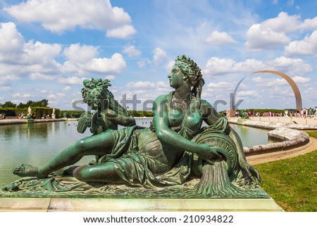 VERSAILLES, FRANCE - AUGUST 05: sculpture in the Garden of the Palace of Versailleson August 05, 2014 in Versailles. Its one of the largest palace complexes in Europe and its protected by UNESCO