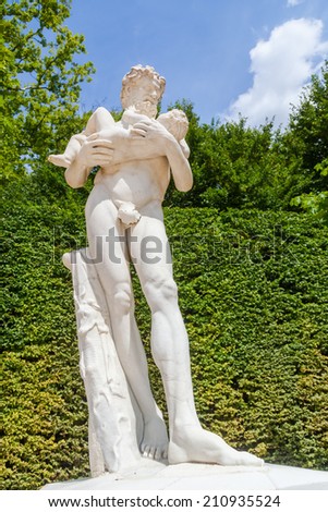 VERSAILLES, FRANCE - AUGUST 05: historical sculpture in the garden of the Palace of Versailles on August 05, 2014 in Versailles. Its one of the largest palace complexes in Europe, protected by UNESCO