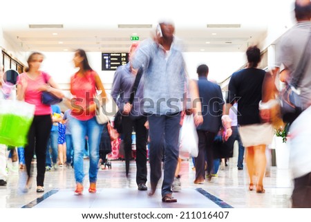 shopping people in motion blur