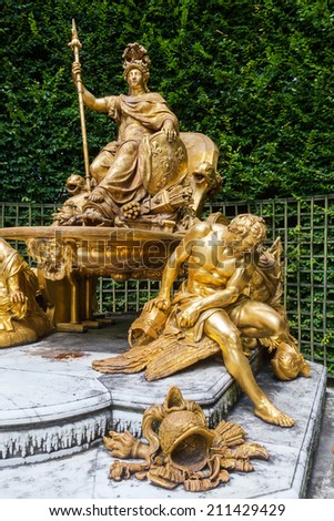 VERSAILLES, FRANCE - AUGUST 05: fountain the triumphant France on August 05, 2014 in Versailles. Palace of Versailles with gardens is one of the largest palace complexes in Europe, protected by UNESCO
