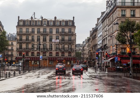 PARIS - AUGUST 03: rue de Seze at the church La Madeleine on a rainy day on August 03, 2014 in Paris. Paris is the largest city in France and one of the most important cities of the western world.