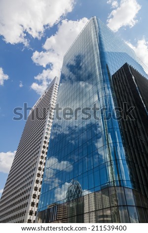 PARIS - AUGUST 05: skyscrapers in the district La Defense on August 05, 2014 in Paris. It is Europes largest business district with 560 hectares area 72 glass and steel buildings and skyscrapers