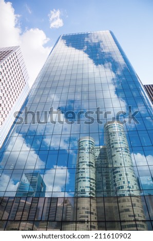 PARIS - AUGUST 05: district La Defense with unidentified people on August 05, 2014 in Paris. It is Europes largest business district with 560 hectares area 72 glass and steel buildings and skyscrapers