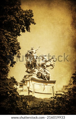 vintage style picture of old sculptures on the Grand Palais in Paris, France