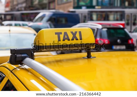 taxi sign of a Czech taxi car in Prague with a blurred street scene in the background