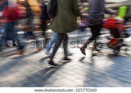 intentional motion blur picture of walking people the pedestrian zone of a city