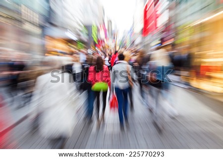 crowd of shopping people in the city with creative zoom effect, made by camera