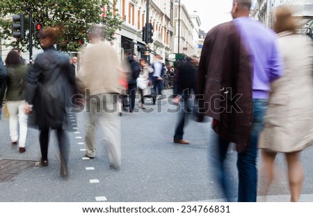 street scene with blurred people in the city of London, UK