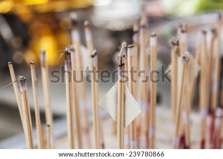 incense sticks at a Buddhist worship place in Bangkok, Thailand