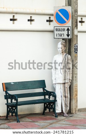 BANGKOK, THAILAND - DECEMBER 10, 2014: unidentified man who is the actor in a private photography performance in support of famous examples in Bangkok