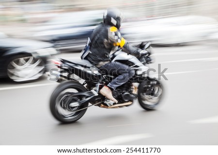 motorbike in city traffic in motion blur