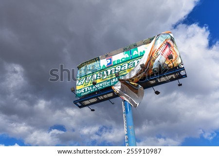 BENIDORM, SPAIN - FEBRUARY 06, 2015: advertising sign at the motorway of Benidorm. Benidorm is a famous travel destination. In holiday Benidorm have more than one and a half millions inhabitants.