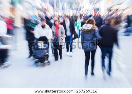 crowd of people in the city with creative zoom effect