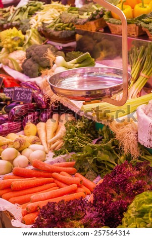 vegetable and fruit market stall with scale
