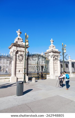 MADRID, SPAIN - MARCH 16, 2015: The Royal Palace of Madrid with unidentified people. Its the official residence of the Spanish Royal Family at the city of Madrid, but is only used for state ceremonies