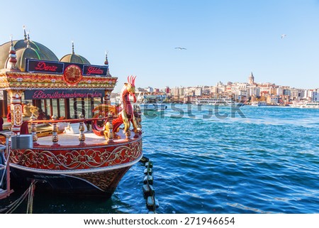 ISTANBUL, TURKEY - APRIL 10, 2015: traditional boat with fish shop on the Golden Horn. Istanbul is the largest city in Turkey and a famous travel destination