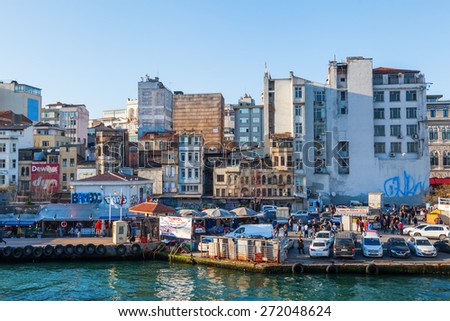 ISTANBUL, TURKEY - APRIL 11, 2015: city view with fish market at the banks of the Golden Horn in the Karakoey district of Istanbul. Istanbul is the largest city in Turkey and famous travel destination