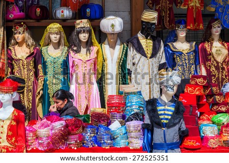 ISTANBUL, TURKEY - APRIL 10, 2015: traditional costume shop with unidentified person near Hagia Sophia in Istanbul. Istanbul is the largest city in Turkey and a famous travel destination