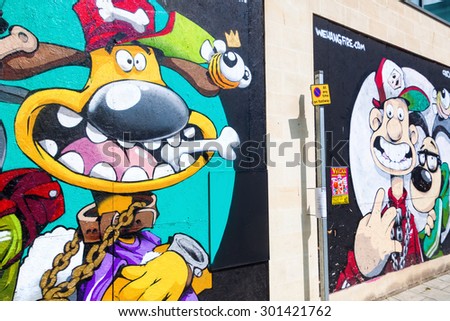 BRISTOL, ENGLAND - JULY 08, 2015: artistic wall paintings in Bristol. It is Englands sixth- and UKs eighth-most-populous city and the most populous city in Southern England outside London.