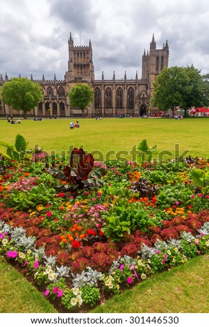 BRISTOL, ENGLAND - JULY 08, 2015: Bristol Cathedral with park and unidentified people. 1542 it became the seat of Bishop of Bristol and the cathedral of the new Diocese of Bristol. Its Grade I listed