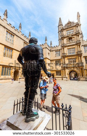 OXFORD, ENGLAND - JULY 03, 2015: Bodleian Library with unidentified people. Its one of the oldest libraries in Europe with over 11 million items and also a film location for Harry Potter and others