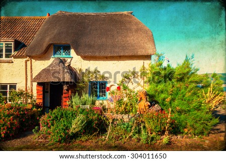 vintage textured picture of a picturesque thatched cottage in Porlock Weir, England