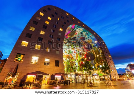 ROTTERDAM, NETHERLANDS - SEPTEMBER 03, 2015: market hall at night, a residential and office building with market hall underneath opened on Oct 1, 2014, by Queen Maxima designed by architect firm MVRDV