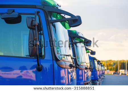 blue trucks in a row