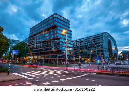 ROTTERDAM, NETHERLANDS - SEPTEMBER 03, 2015: Loyens and Loeff headquarter and new market hall in Rotterdam. Rotterdam is home to Europes largest port and has a population of 625.000 ranking 2nd in NL