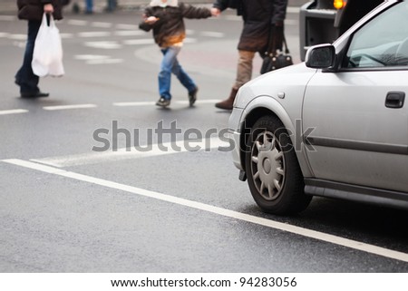 urban traffic scene at a pedestrian crossing