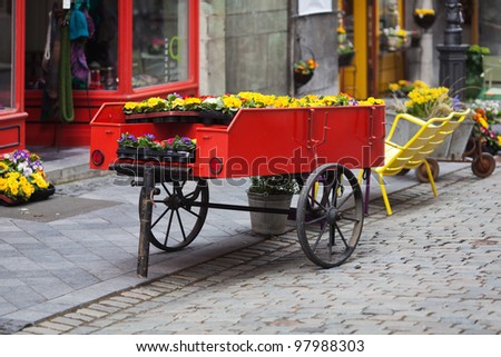 flower stall on an ancient trailer in an old town