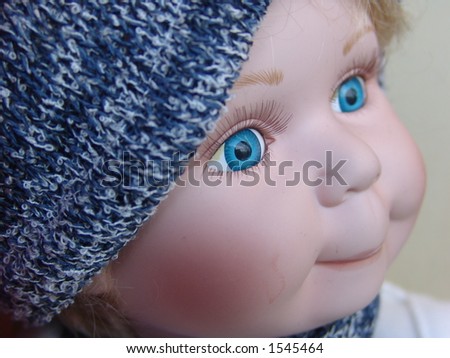 Doll face with sweet blue eyes at a shop window in Bergen, Norway