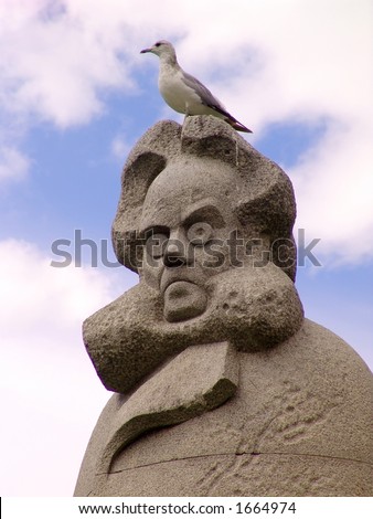 The statue of Henrik Ibsen, famous Norwegian writer, with a seagull on his head.  Seagulls in Bergen have absolutely no respect for important people.