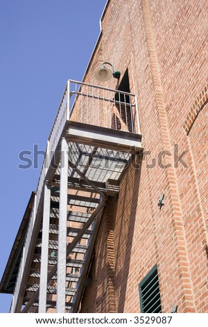 Upstairs Exterior Stage Door at the Top of a Metal Staircase.