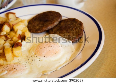 Fried Egg Breakfast with Sausage and Potatoes