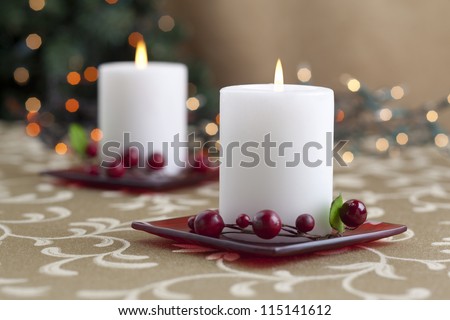 A horizontal image of dinner table with two lighted candle