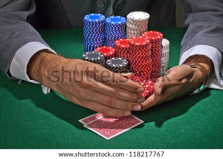 Close up image of guy playing poker