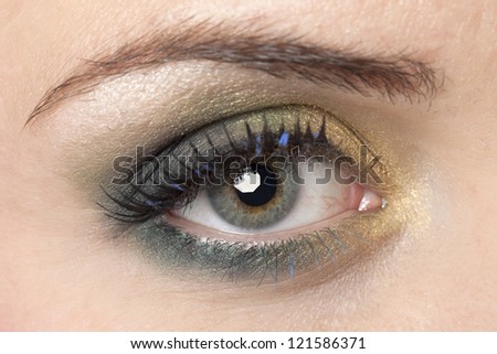 Image of a woman with the camera focused on her eye make up