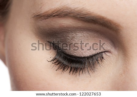 Closed eye of a woman with long eye lashes